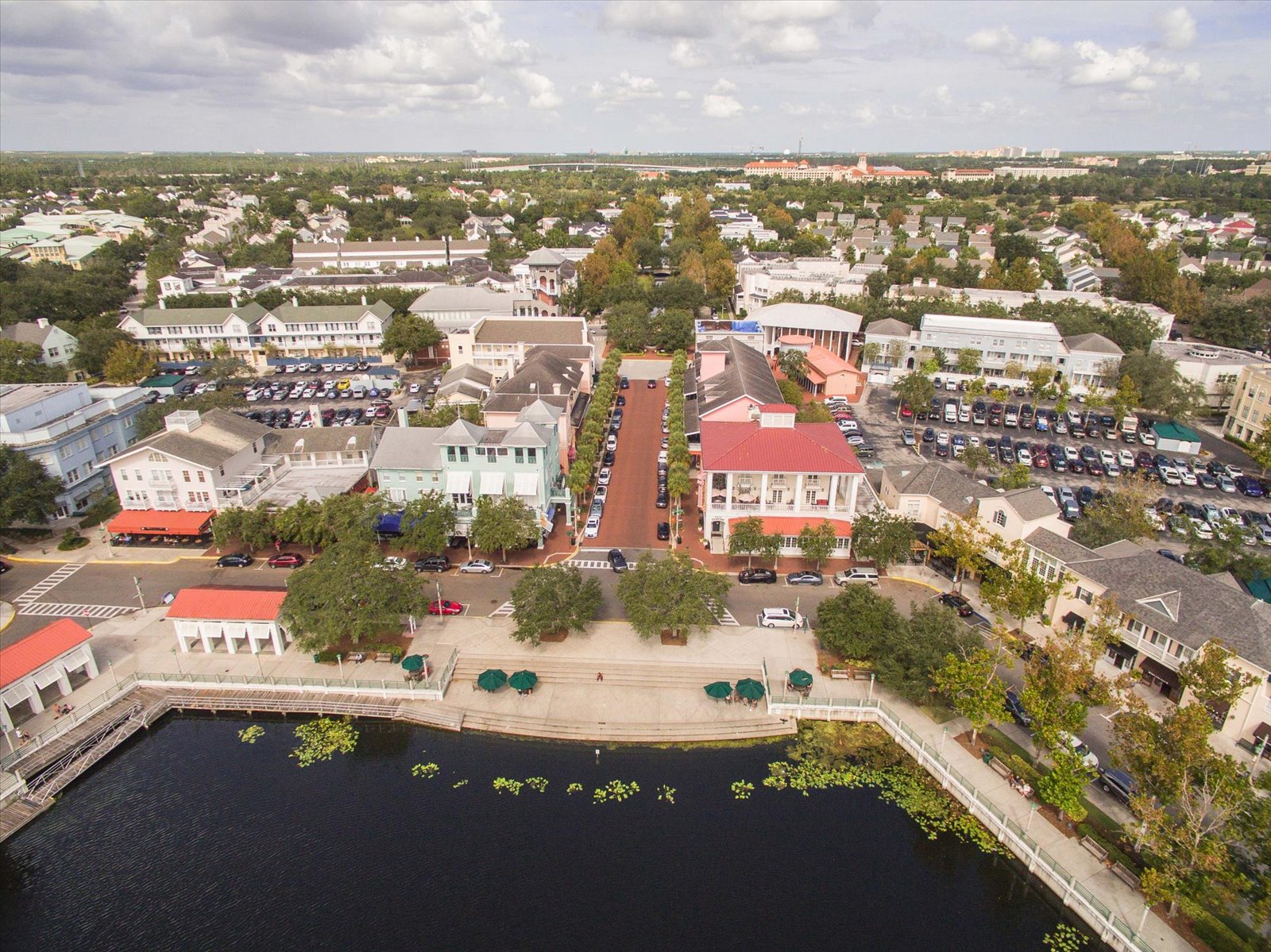 Aerial view over downtown Celebration's main street and waterfront promenade