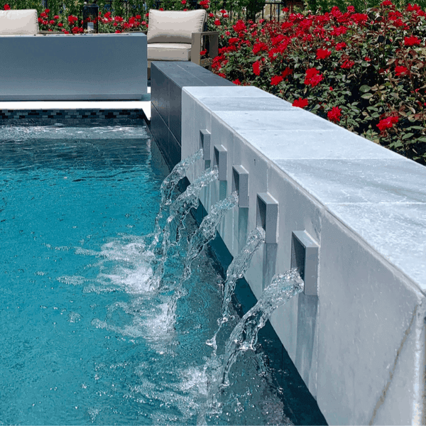 scuppers are a great swimming pool water feature